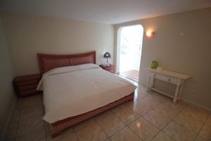 a bedroom with a large bed and a window at Sunny House, Chayofa in Chayofa +28 photos