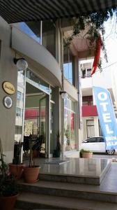 a entrance to a building with a car parked outside at Sirin Villa in Cesme