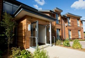 a house with a pivot door in front of it at Sandford Springs Hotel and Golf Club in Kingsclere +28 photos