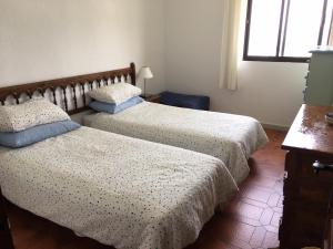 Postel nebo postele na pokoji v ubytování PALMERAS 53 MENYBER