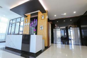 a lobby with a reception desk in a building at Magic Suite Boulevard Salmiya in Kuwait