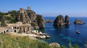 an island with a castle on top of a body of water at Bed And Breakfast Maria in Scopello