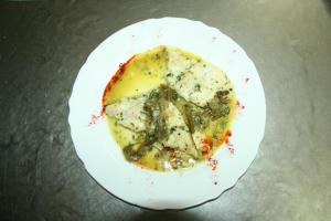 a white plate with a piece of food on it at Bungalows Camping Parque Nacional de Monfragüe in Malpartida de Plasencia