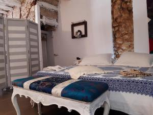 Ένα ή περισσότερα κρεβάτια σε δωμάτιο στο Cozy Loft in the Heart of Cagliari