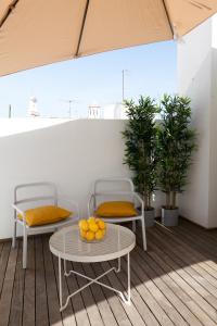 Un balcón o terraza de GoToSeville GERONA SUITES
