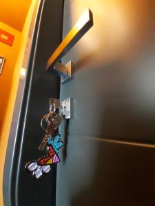a door knob with a bunch of butterflies on it at CameLia in Ivrea