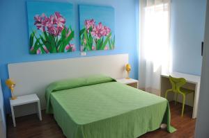 Postel nebo postele na pokoji v ubytování I Tre Fiori