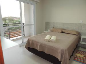 Llit o llits en una habitació de Casa de Praia em Torres RS Praia Lagoa jardim