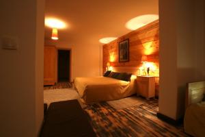 A bed or beds in a room at Mecavnik Resort