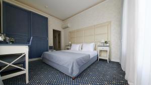 Кровать или кровати в номере Блюз Отель