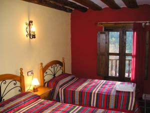 Giường trong phòng chung tại Casa La Mestra