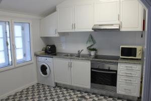 A cozinha ou cozinha compacta de Vigia's Guest House