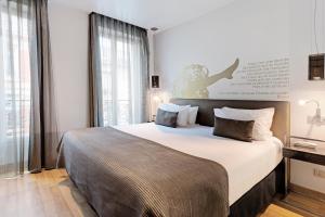 Una cama o camas en una habitación de Exe Panorama 21 fotos más