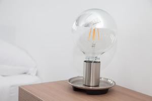 a light bulb sitting on top of a table at Cocor Suites & Design in Naples