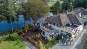 an aerial view of a house with a lake at Killarney View House B&B in Killarney