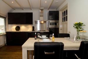 Hof Van Lenthe appartementen tesisinde mutfak veya mini mutfak