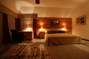 A bed or beds in a room at Mecavnik Resort