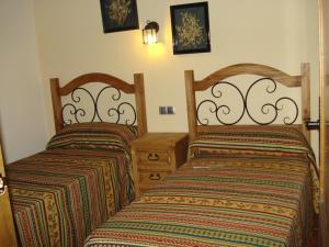Кровать или кровати в номере Vivienda Turística Rural Entrepinares