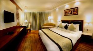 Postel nebo postele na pokoji v ubytování Hotel Regent Grand
