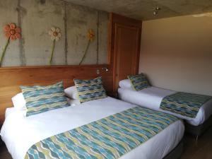 Postel nebo postele na pokoji v ubytování Hotel Amun
