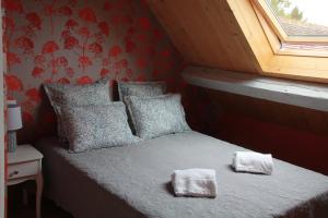Postel nebo postele na pokoji v ubytování Manoir le Bout du Pont