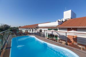 a swimming pool on the roof of a building at Villa Rio Branco Hotel Concept in Rio Branco