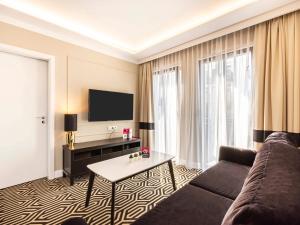 Un televizor și/sau centru de divertisment la VacationClub – Baltic Park Fort Apartament E.201
