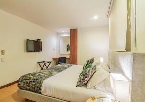 En eller flere senger på et rom på Hotel Factory Green Bogotá