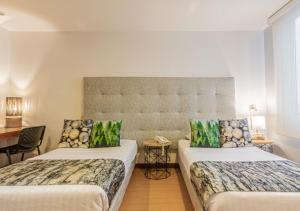Hotel Factory Green Bogotá客房内的一张或多张床位