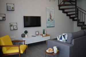 Televízia a/alebo spoločenská miestnosť v ubytovaní Amarena Holiday Home in Škrljevo