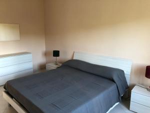 Ένα ή περισσότερα κρεβάτια σε δωμάτιο στο Le case di Nonna Gina