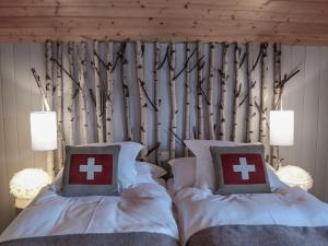 Postel nebo postele na pokoji v ubytování Hôtel Le Grand Chalet Favre