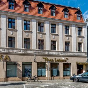 a building with a bike parked in front of it at J&J Apartments, Szczytna 1, Apartament 9 in Toruń