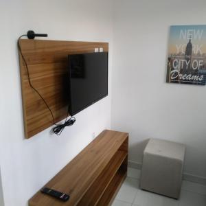 En tv och/eller ett underhållningssystem på Residencial Dom Laurindo