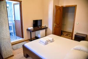 Postel nebo postele na pokoji v ubytování Hotel Sofra