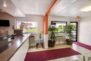 an office with potted plants and a desk at Motel 6-Rossford, OH in Rossford