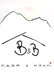 eine Zeichnung eines Gradierhut mit den Buchstaben k und g in der Unterkunft MARA E MONTI in Tossicia