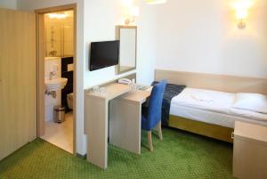 Postel nebo postele na pokoji v ubytování Arche Hotel Siedlce