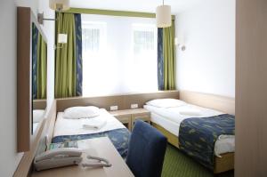 Postel nebo postele na pokoji v ubytování Arche Hotel Siedlce