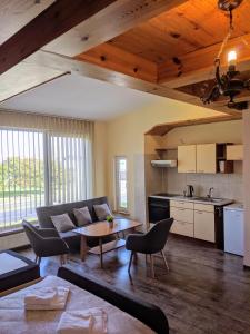 a living room with a couch and a table at Guest House Kamara in Panevėžys