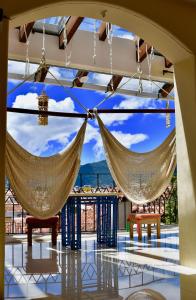 a room with two hammocks hanging from the ceiling at Magnolias Boutique Suites & SPA in San Cristóbal de Las Casas