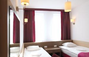 Postel nebo postele na pokoji v ubytování Arche Hotel Siedlce