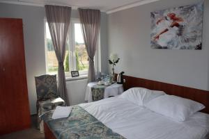 Posteľ alebo postele v izbe v ubytovaní Restauracja Hotel Kassandra + 37 fotografií