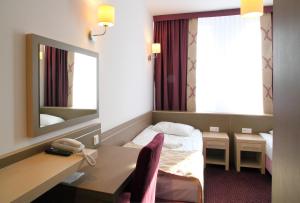 Postel nebo postele na pokoji v ubytování Arche Hotel Siedlce