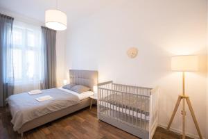Postel nebo postele na pokoji v ubytování FAMILY Apartment OSTRAVA
