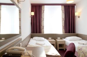 Ένα ή περισσότερα κρεβάτια σε δωμάτιο στο Arche Hotel Siedlce