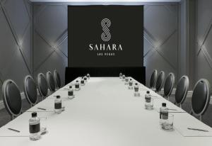 a conference room with a white table and bottles of wine at SAHARA Las Vegas in Las Vegas