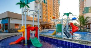 a water park with a playground in a mall at Apartamento em Resort de Olimpia in Olímpia +6 photos