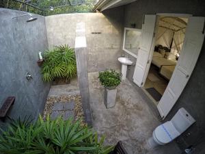 an aerial view of a bathroom with a toilet and a sink at The Horizon Hill Top Villa in Unawatuna