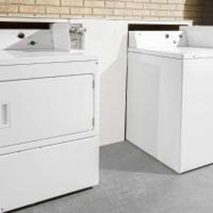 a kitchen with white counters and white appliances at SureStay Hotel by Best Western Terrell in Terrell